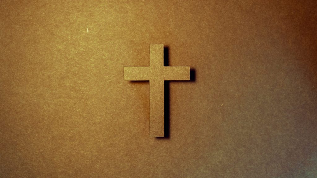 Cross against a brown background for Good Friday