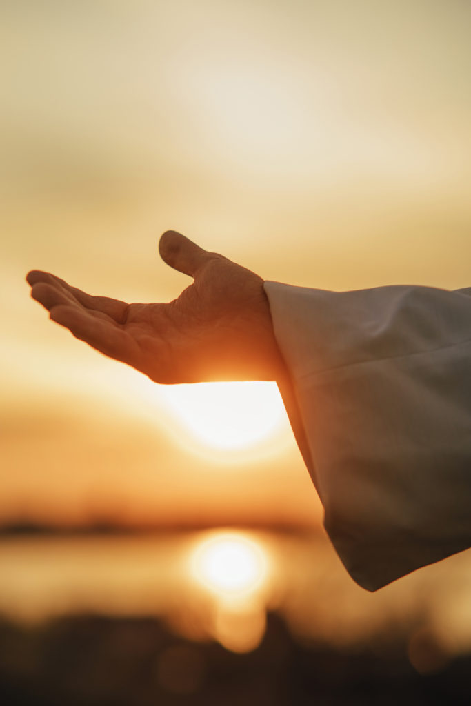 An open hand at sunset looks for an answer to the question, "Did Jesus meditate?"