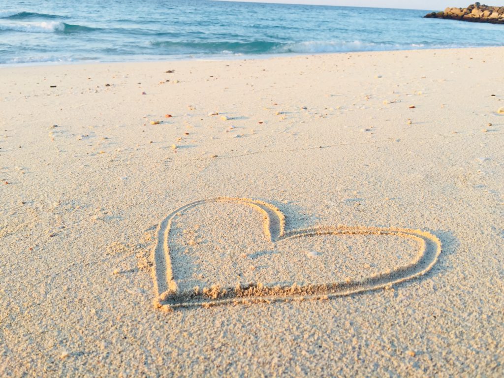 A heart drawn in the sand reminds us to prayer a morning prayer about loving God.