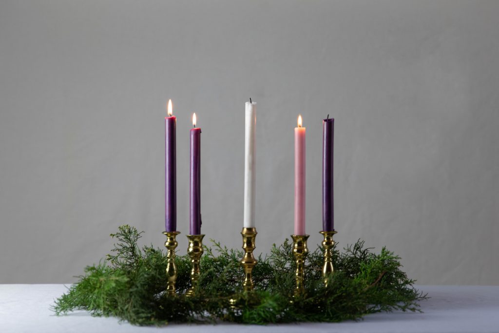 The third candle of an Advent wreath is lit reminding us to pray a prayer for the third week of Advent.