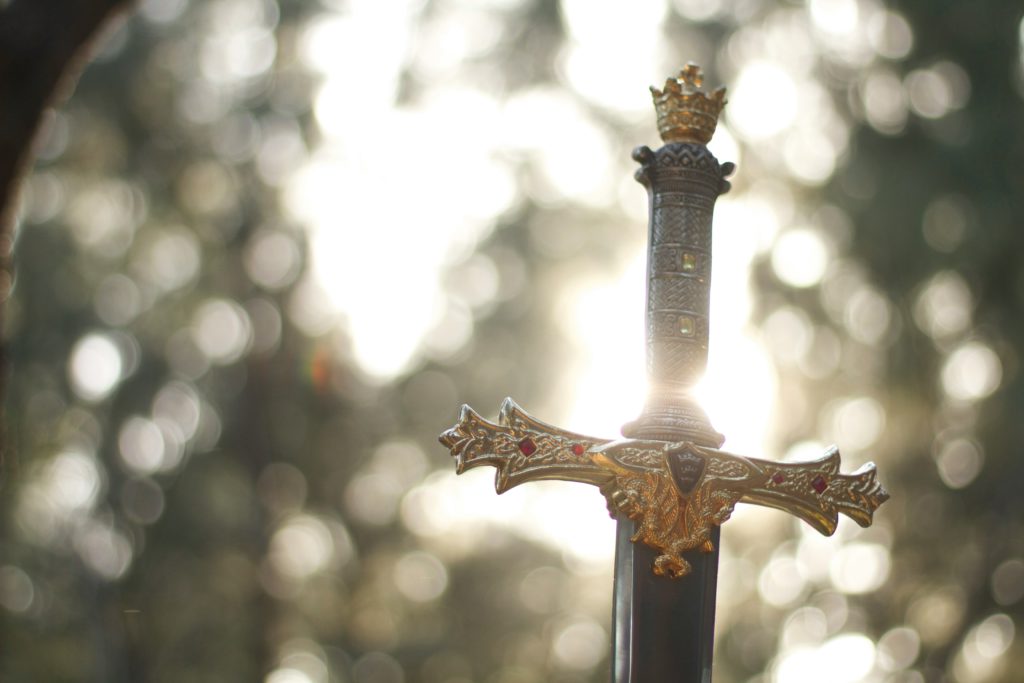 A sword drenched in sunlight represents the Word of God, and Bible verses that help conquer anxiety.