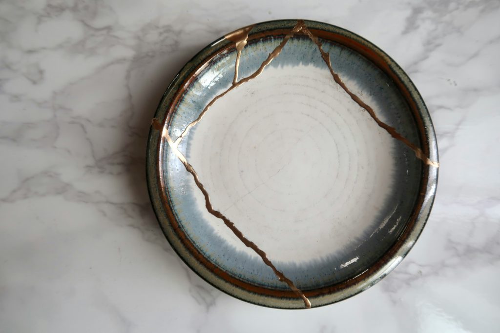 A bowl repaired with the Kintsugi method of using gold in the cracks displays the miracles and might of God in transforming our broken lives.