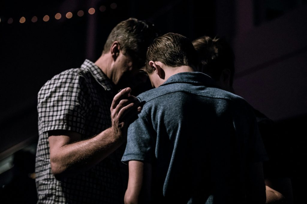 Two men praying together can show God's power to heal when we pray for each other.
