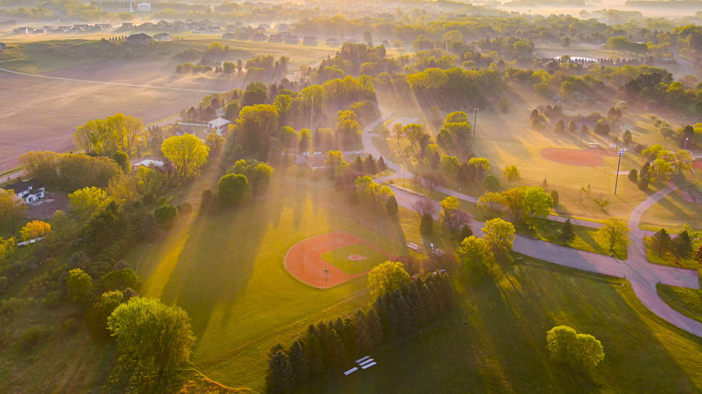 royalty free image_Aerial view of ball park at Spring sunrise with long shadows in misty air that helps you in catching hope.