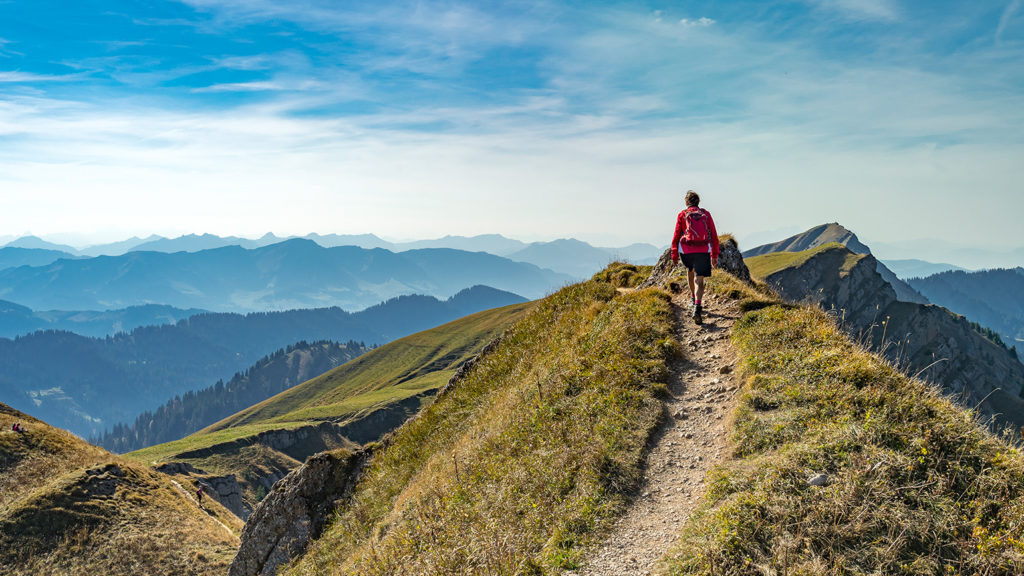 Royalty-Free Stock Photo: Person hiking in the Alps, following God's plan.