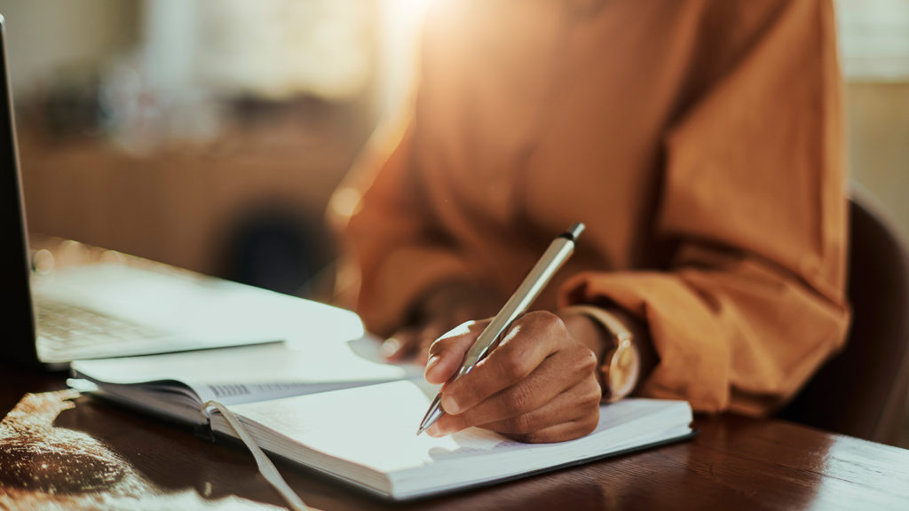 Royalty-Free Stock Photo: Woman journaling.