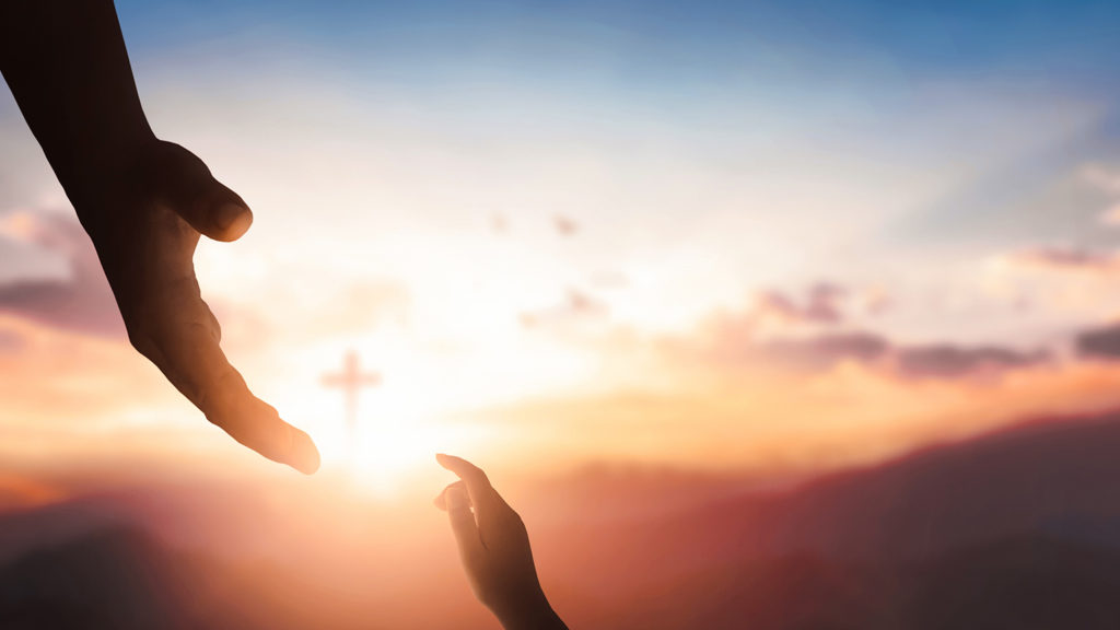 Royalty-Free Stock Photo: Silhouettes of hands reaching out for hope and help to overcome spiritual hurdles an deepen faith on sunset background.