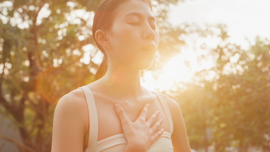 Royalty-Free Stock Photo: Woman outdoors trying to seek confidence in God's image.