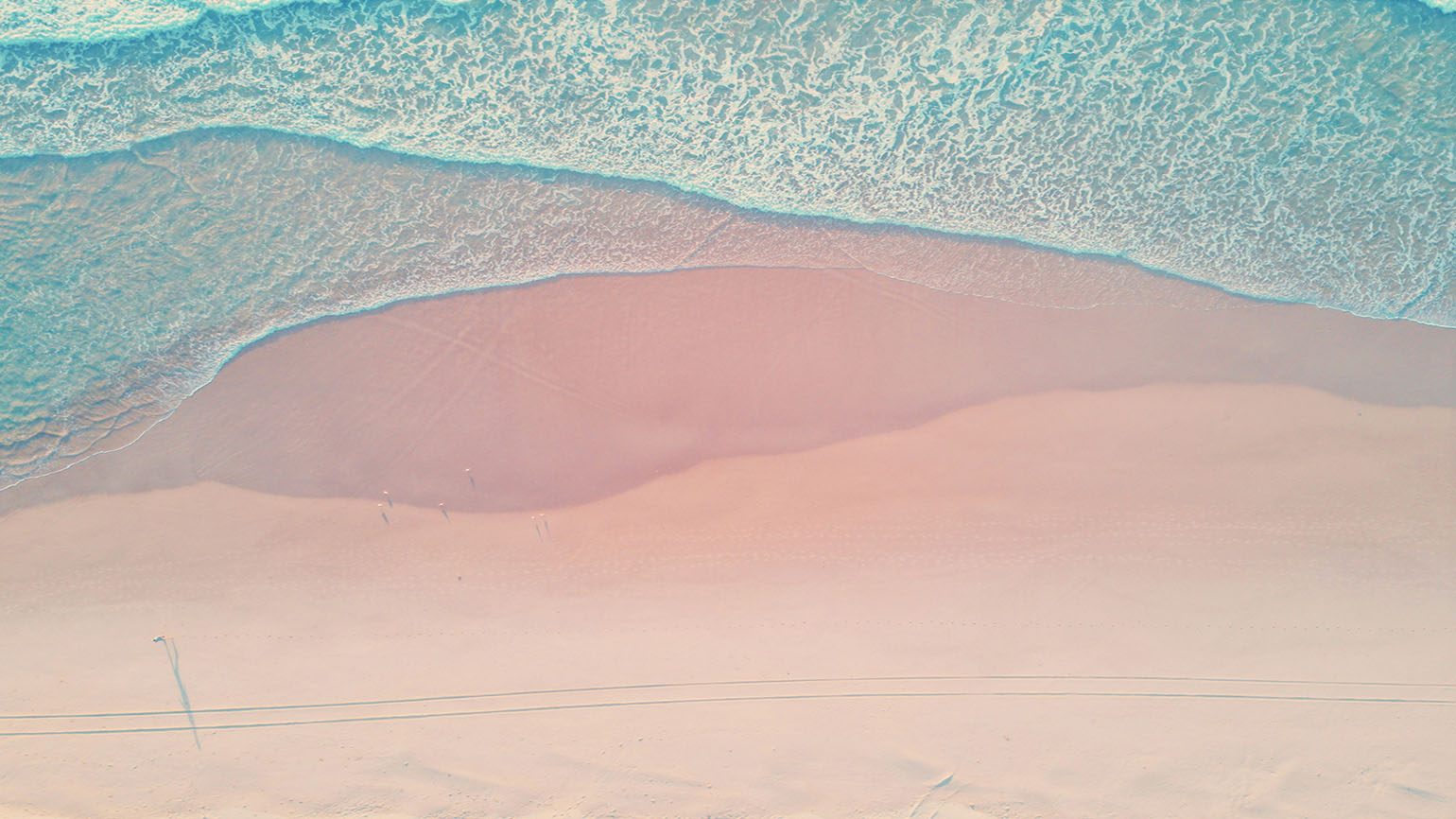 A scene of pink sand and blue water remind us to find our source of contentment in God.