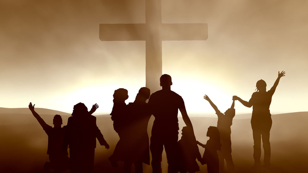 Silhouettes of family and people at the Cross of Jesus Christ knowing they will face challenges in their church family.