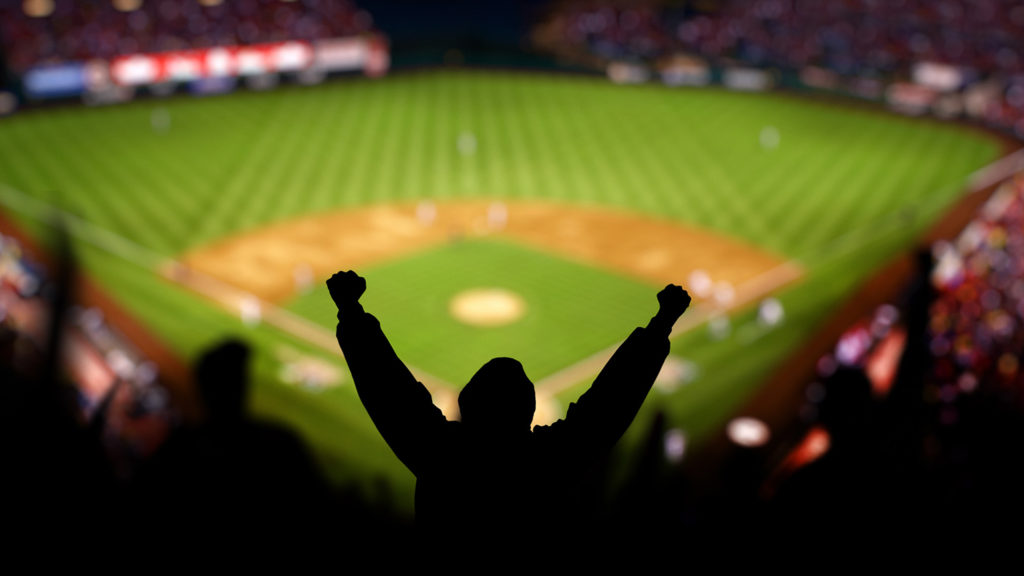 Royalty-Free Stock Photo: Excited fans at a baseball game.