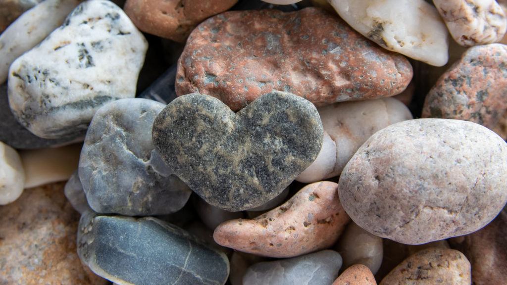 A heart-shaped stone in a pile of other stones reminds you of God's faithfulness when calming your heart.