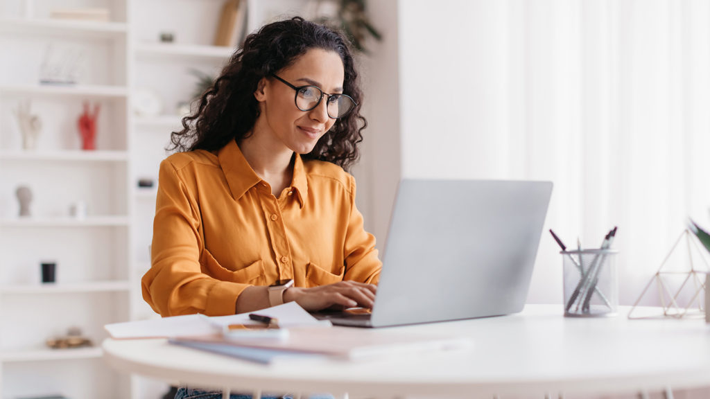 Royalty-Free Stock Photo: Woman working on a laptop.