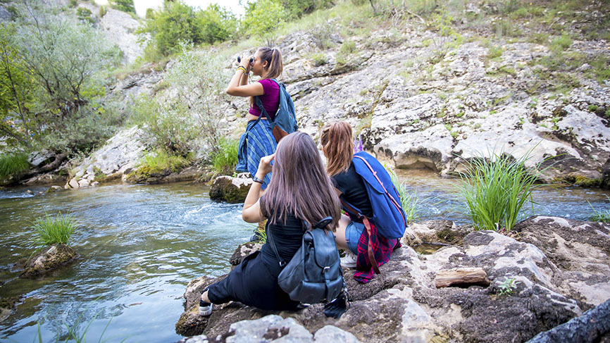 three friends explore the wilderness as the remember Bible verses for travel.